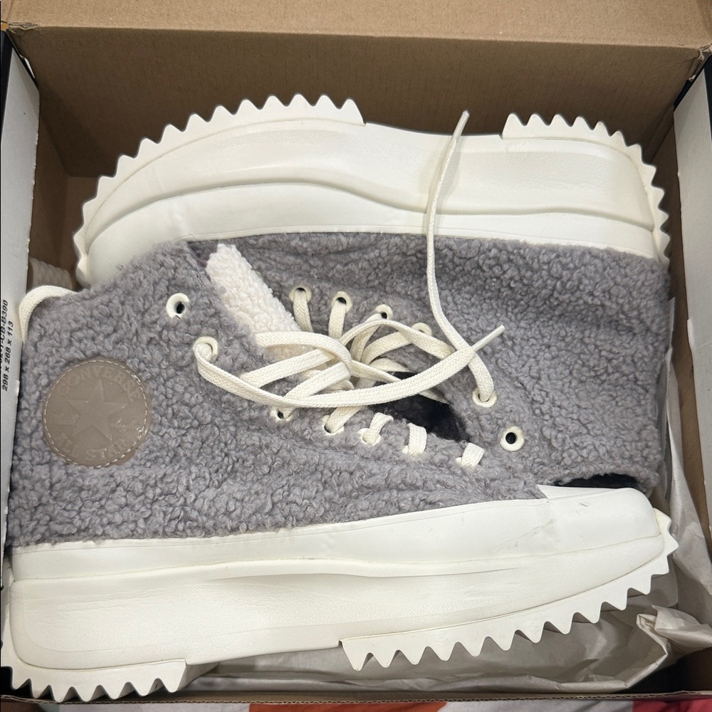 Gray and White High-Top Converse sneakers